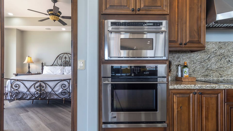 appliances in the kitchen, going into the main bedroom.