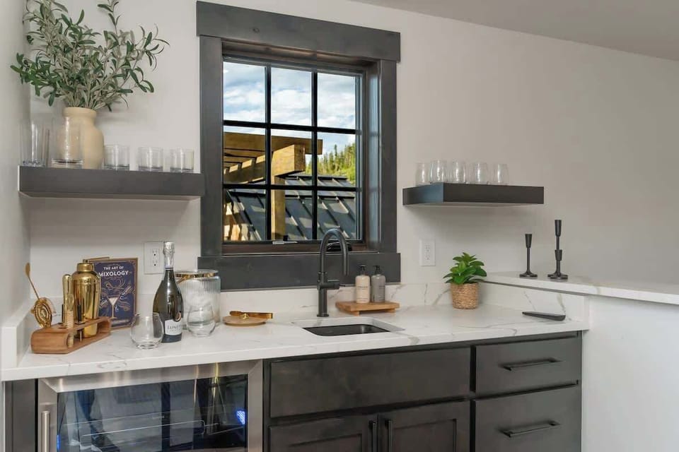 - Sip and unwind with your own stylish wet bar setup and glassware stocked
- Craft cocktails or pour wine while enjoying rooftop views from the window
- Sleek design meets function for happy hour, nightcaps, or morning brews