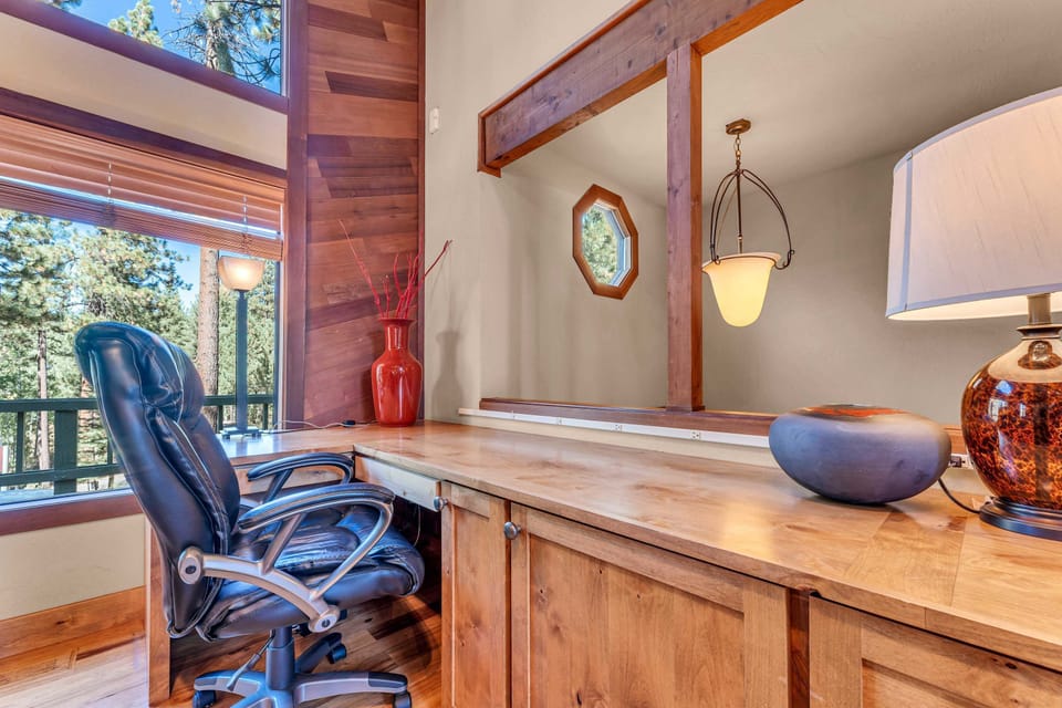 Living Room: Dedicated workspace, office chair and desk
