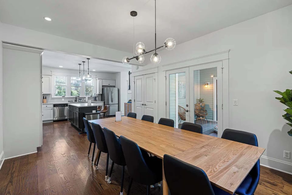 A spacious dining table serves as the centerpiece of this inviting gathering space.