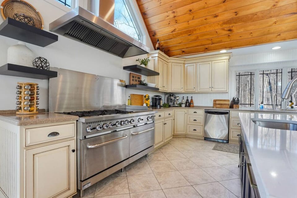 Kitchen with Industrial Sized Stove, and Fully Stocked Coffee Bar