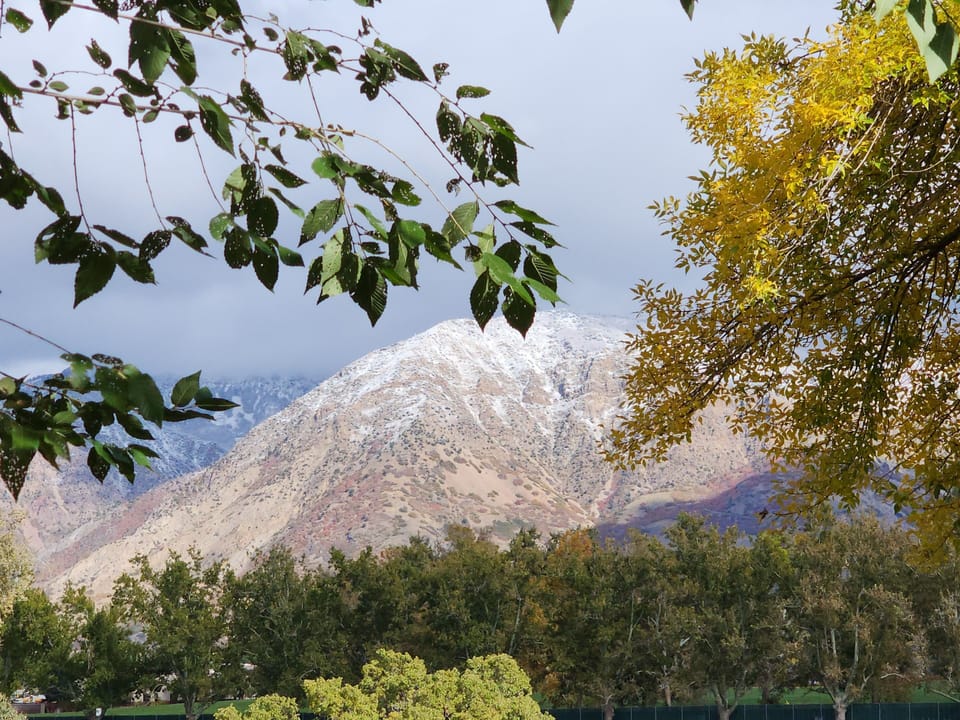View of snow on mountains from the front porch of the house.