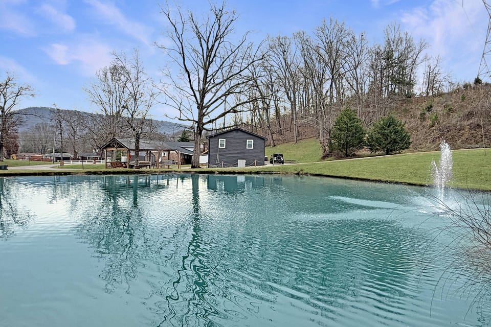 Welcome to Pond Vista Retreat - enjoy fishing in the private stocked pond with view of Lookout Mountain in the background
