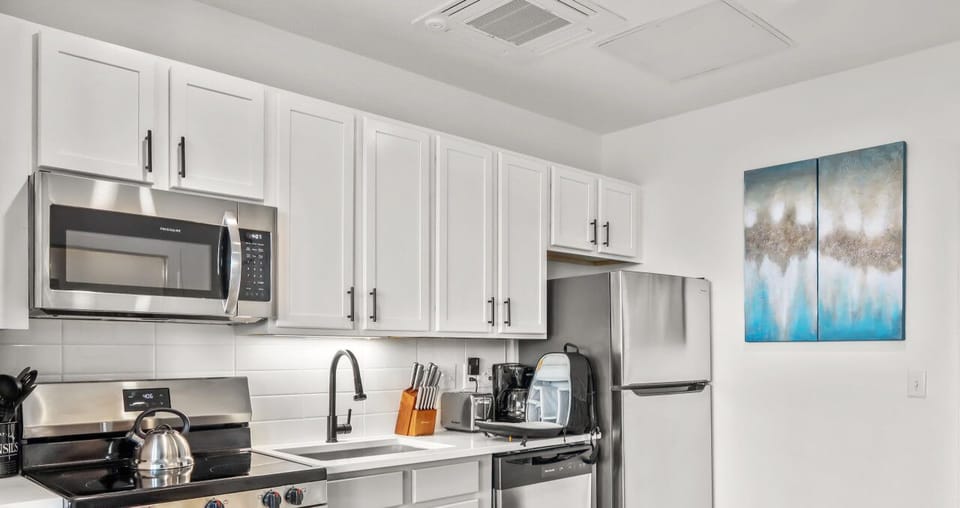 Enjoy cooking in a sleek, modern kitchen with high-end appliances, cookware, and utensils—all thoughtfully designed to meet your needs.