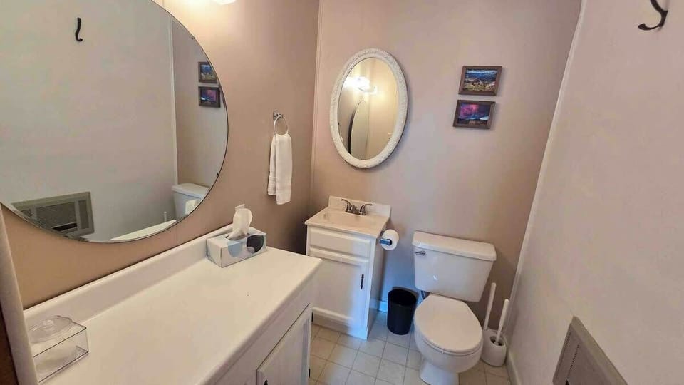 Half bathroom upstairs with nice vanity