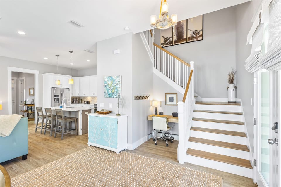Bright open-plan living with coastal touches welcomes you home. Your kitchen island invites morning coffee while natural light flows throughout.