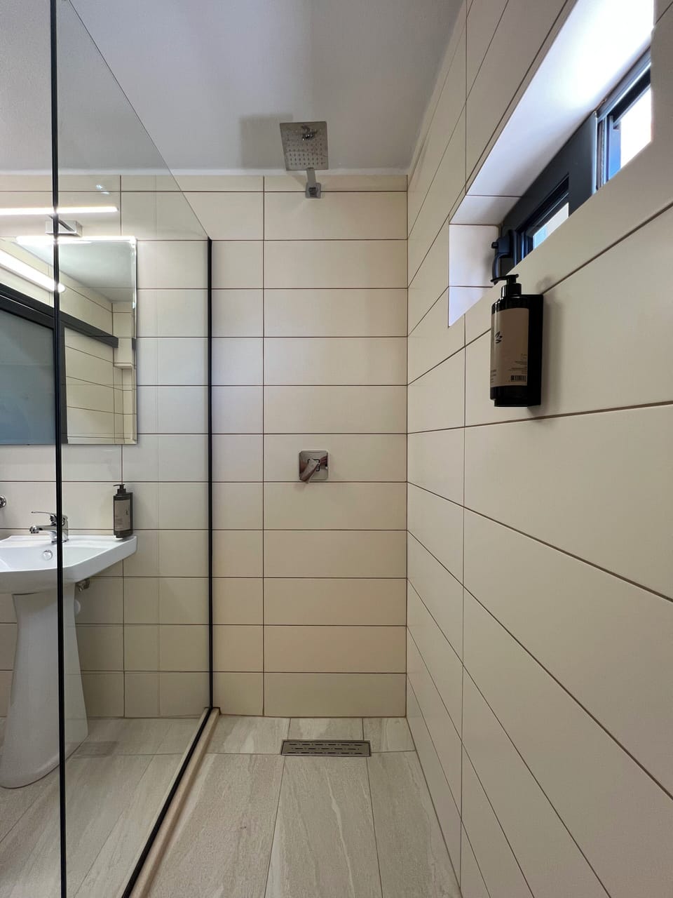 Shower, hair dryer, slippers, towels