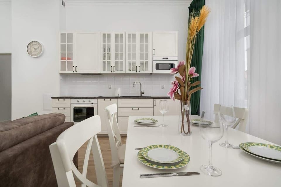 The view from the dining area to the kitchenette and living room showcases the apartment's comfort and harmony.