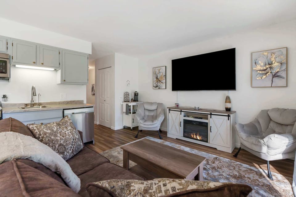 Enjoy comfortable furnishings and open-concept flexibility in the Living/Dining Areas and Kitchen