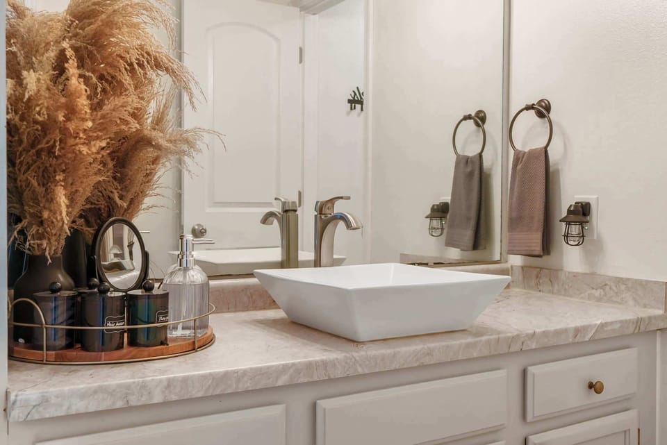 Enjoy ample storage space and beautiful finishes in the Bathroom, offering a Shower/Tub Combo