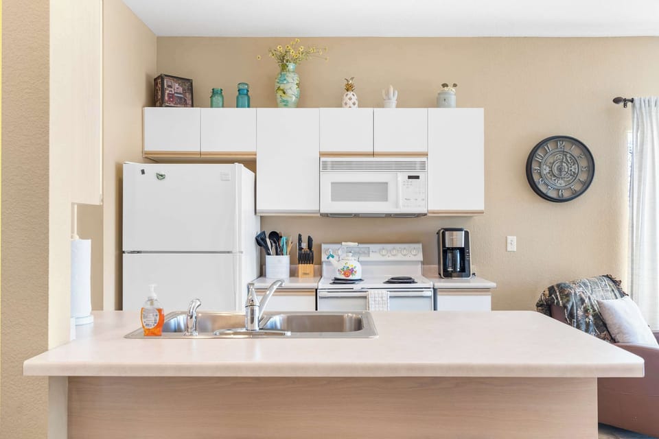 The open, airy kitchen offers ample space & all the comforts of home