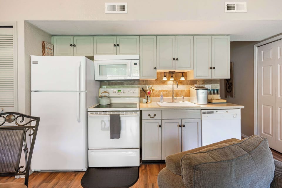 The open, airy kitchen offers ample storage & every home comfort