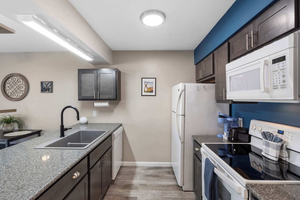 The open, airy kitchen offers ample space & all the comforts of home