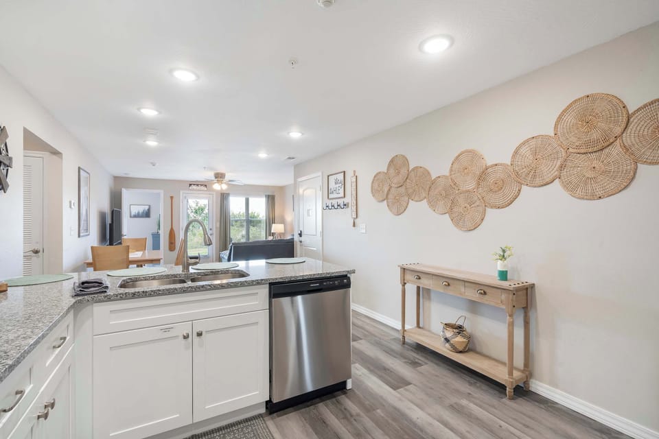 The open, airy kitchen offers ample space & every home comfort