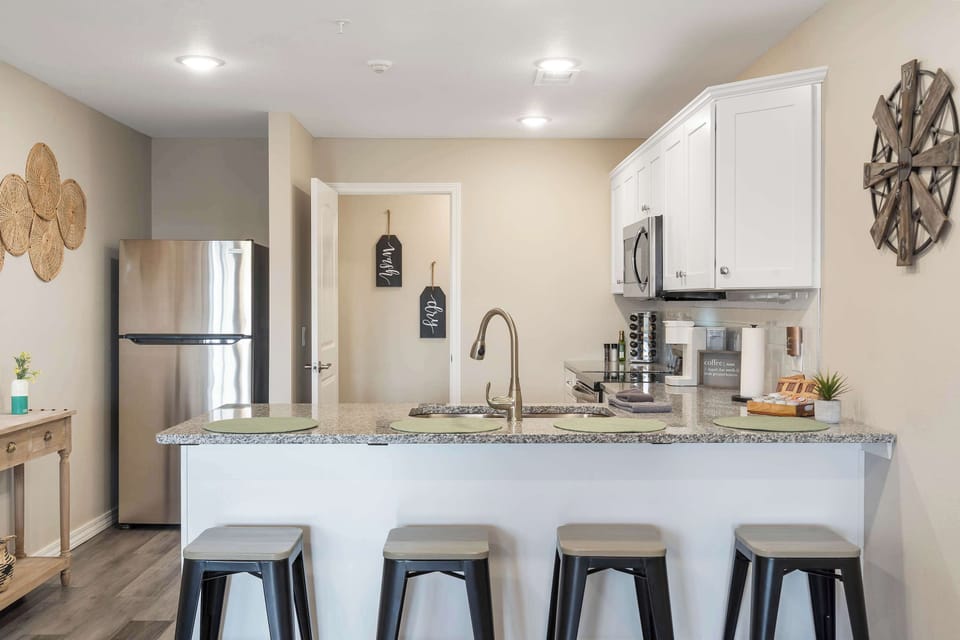The open, airy kitchen offers ample space & every home comfort