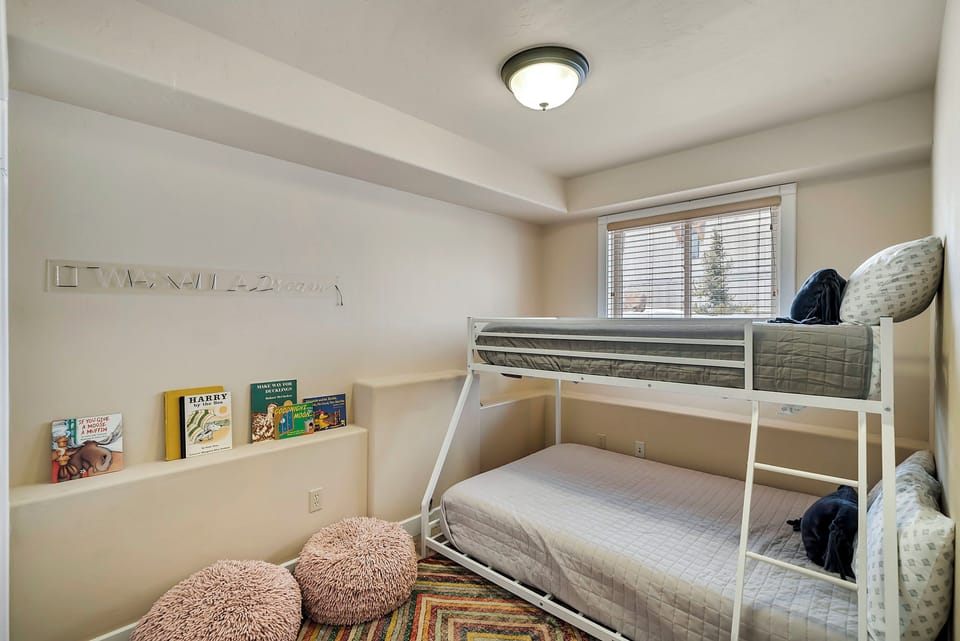 Fourth bedroom offers a twin over full bunk bed, closet space, and TV. 
Pack and play located in the closet. 
Bed with Triple Sheet Method include two sheets to encase the comforter.  This sheet-made duvet cover gets washed between each and every guest to provide an extra clean sleeping experience.