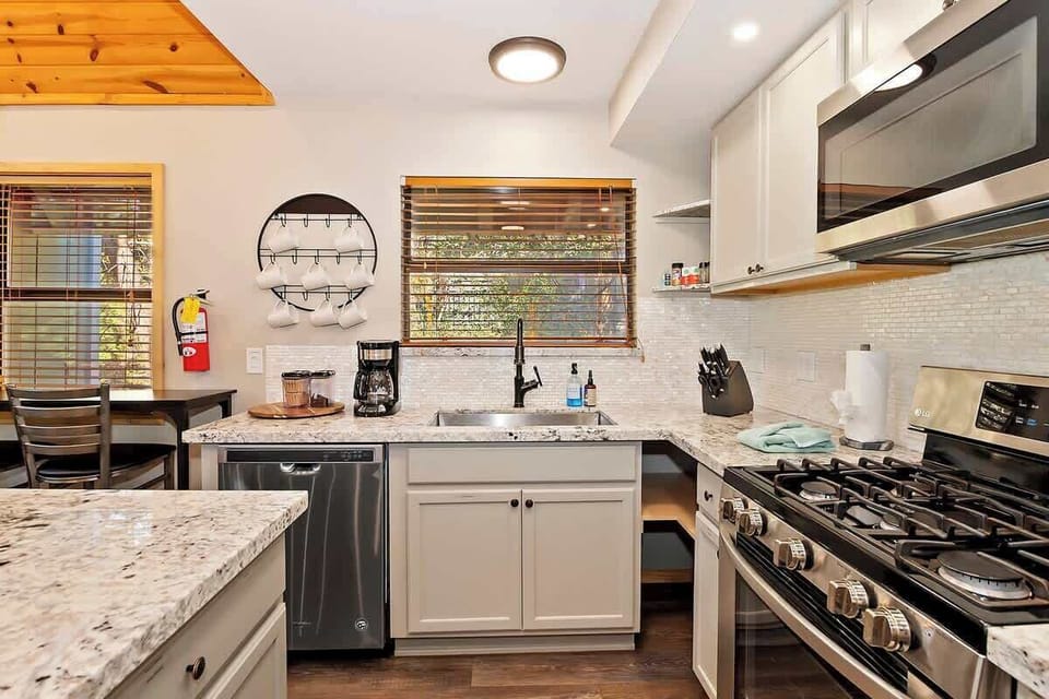 Kitchen space equipped with pots, pans 