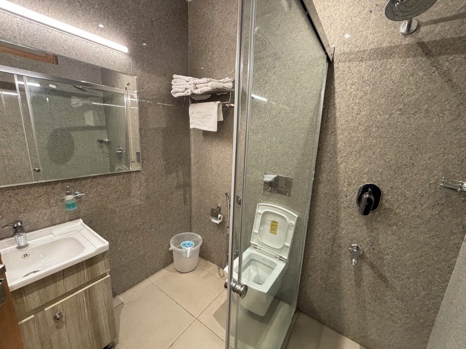 Luxury Triple Room, Park View | Bathroom | Shower, slippers, towels, soap