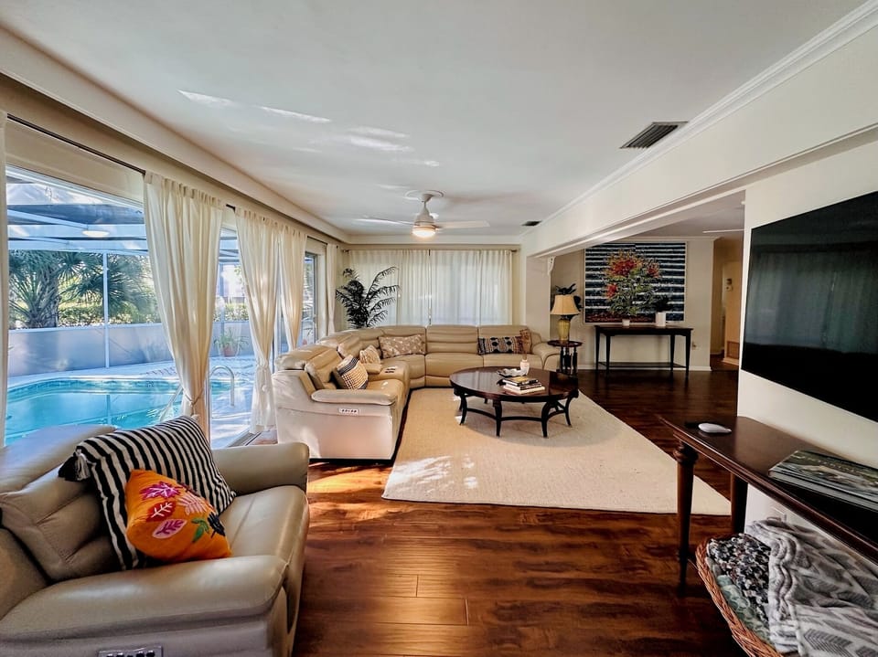 Expansive living space featuring a premium leather reclining sectional.