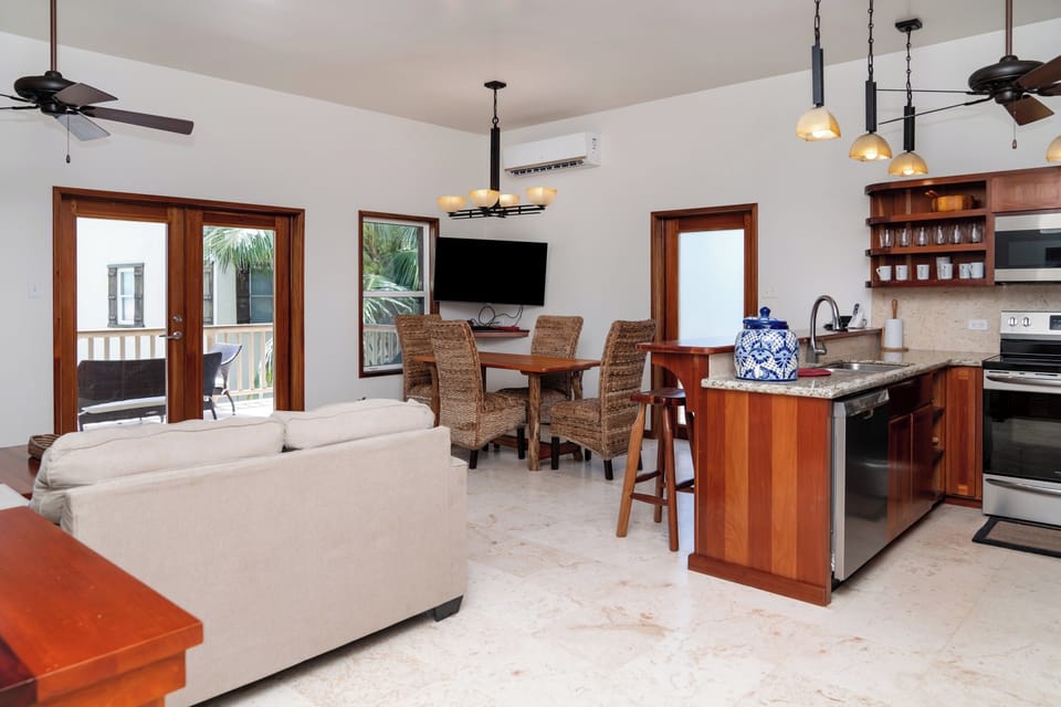Open concept condo with private balcony overlooking the resort