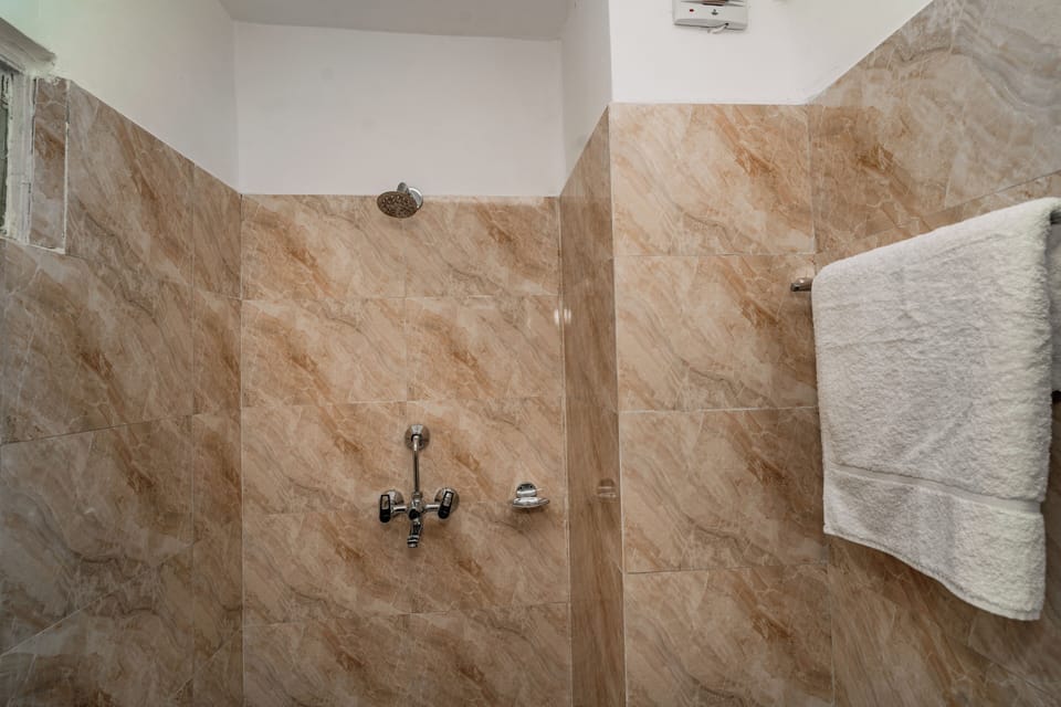 Shower, rainfall showerhead, slippers, towels