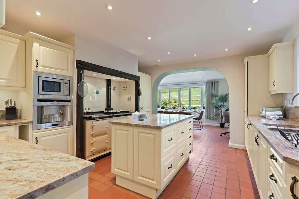 The large kitchen is fully equipped with everything you need for your long or short stay with us. There is a full AGA range cooker, electric hob, fridge/freezer, dishwasher, integrated bean to coffee machine, microwave, toaster and kettle