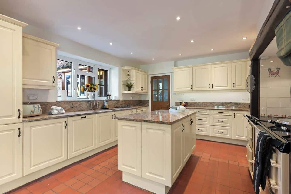 The large kitchen is fully equipped with everything you need for your long or short stay with us. There is a full AGA range cooker, electric hob, fridge/freezer, dishwasher, integrated bean to coffee machine, microwave, toaster and kettle