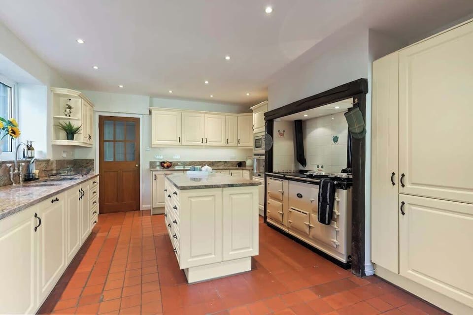 The large kitchen is fully equipped with everything you need for your long or short stay with us. There is a full AGA range cooker, electric hob, fridge/freezer, dishwasher, integrated bean to coffee machine, microwave, toaster and kettle