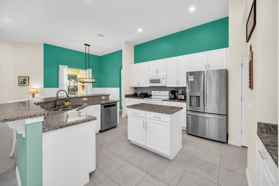Bright, open-concept living space with a fully equipped kitchen. We have everything you need to cook!