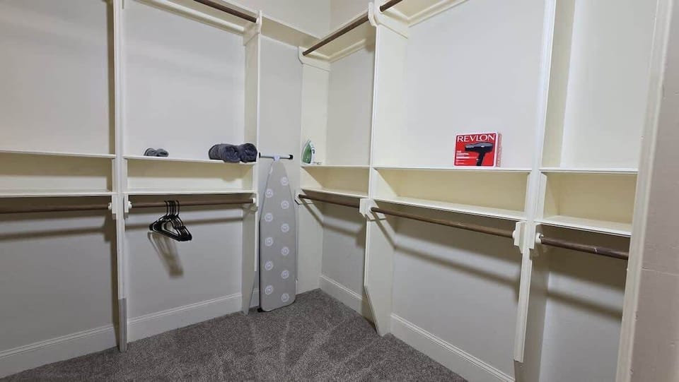 Neat walk-in closet for extended stays and convenient luggage storage.