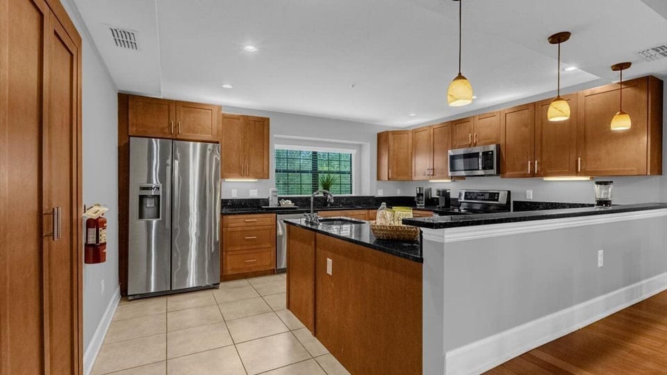 Townhome, Garden View | Private kitchen | Full-size fridge, microwave, oven, stovetop