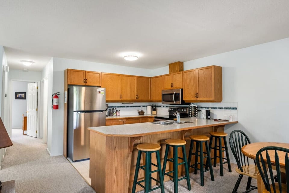 Full kitchen complete with a drip coffee maker, blender waffle maker, mixer & more.