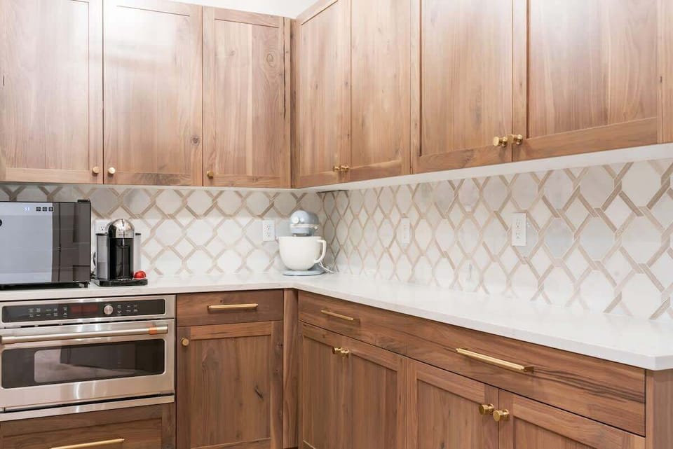 The walk-in pantry is huge, and offers extra counter space, a microwave, and coffee station.