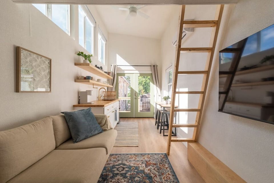 View of the under loft living space w/ 55` TV for R&R between Austin exploring sessions