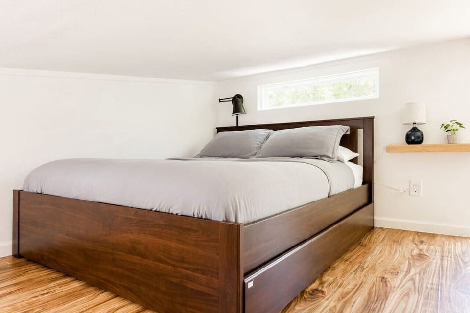 Queen bed with luxury linens in the spacious loft