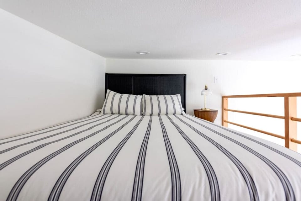 Comfy queen with extra soft linens; two different types of pillows for those of you that need pillow variety!