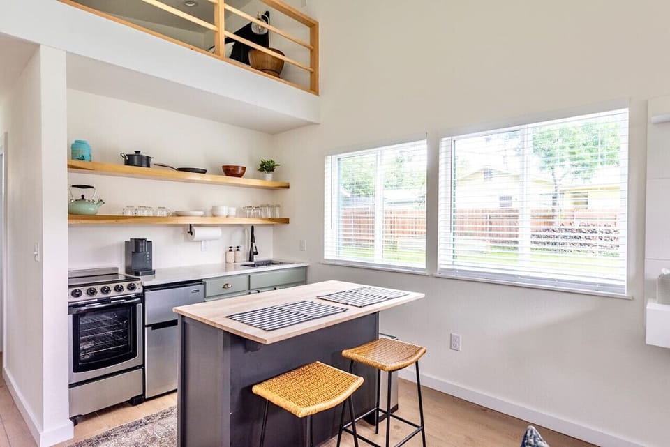 Counter height dining space perfect for a date night or set-up for remote working