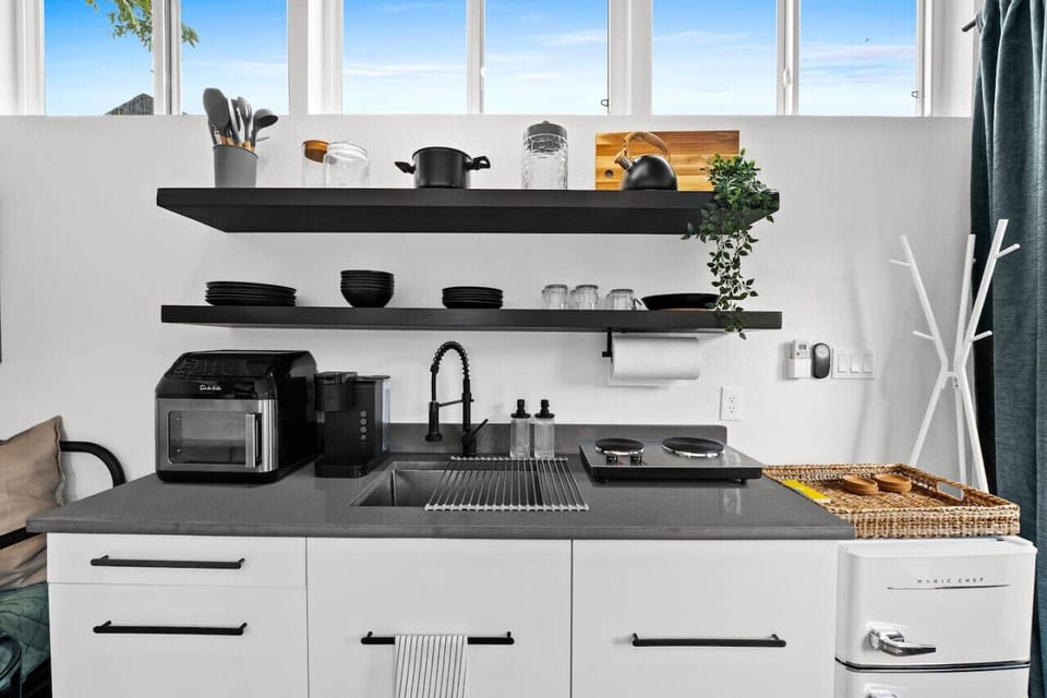 Full kitchen with electric stove top appliance and an air fryer! Easily stored when not being used to maximize counter space