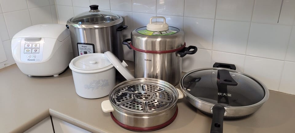 Prepare Asian meals with appliances including rice cooker, wok, steamer and multi-function cooker.