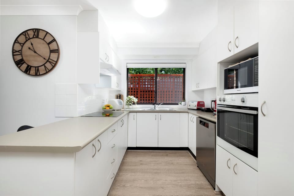 Induction cooktop, oven and microwave make for easy meal or snack preparation.