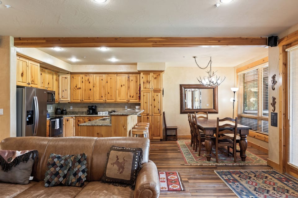 - Spacious kitchen and dining area with rustic charm  
- Granite counters and stainless appliances throughout  
- Large table with window views for family dinners