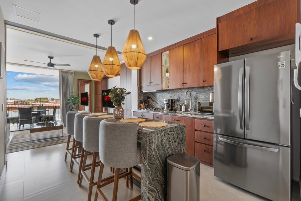 Sleek, modern kitchen fully equipped with high-end appliances and premium cookware—everything you need to cook, dine, and entertain in style.