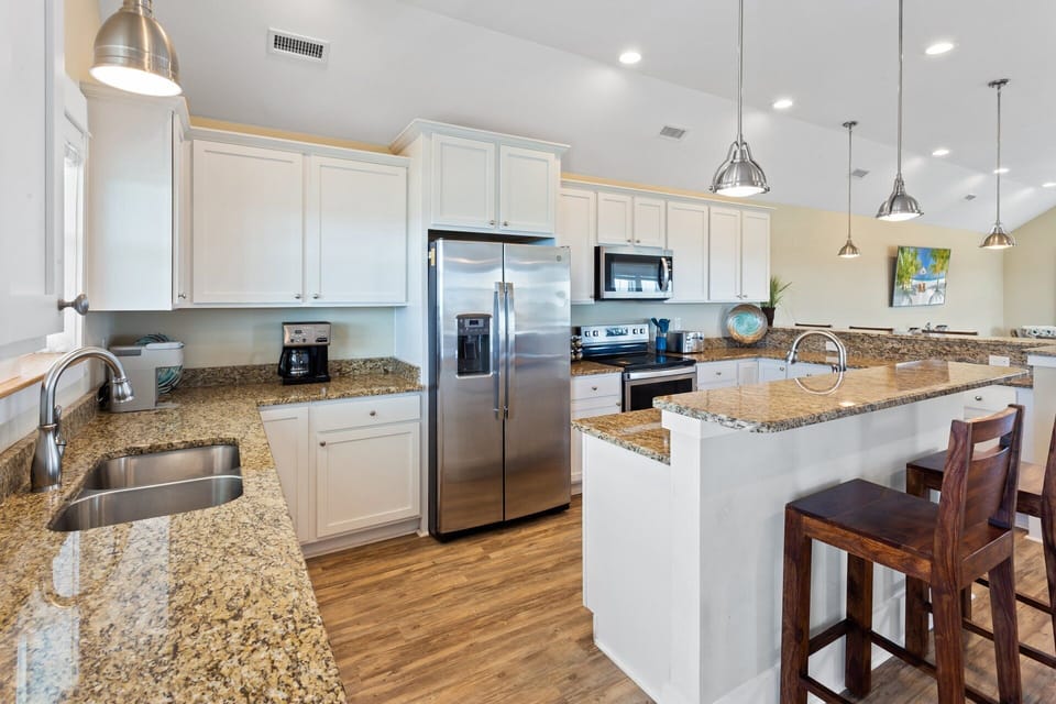 Whip up something delicious in the state-of-the-art Kitchen featuring elegant granite countertops and gleaming stainless steel appliances.