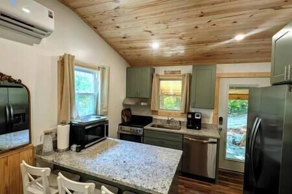 Full kitchen including stove, oven, dishwasher, refrigerator, freezer, microwave, coffee maker, etc.