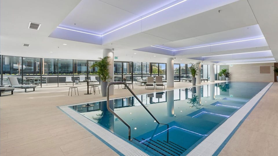Enjoy a refreshing swim in the sparkling shared pool, steps from your door.