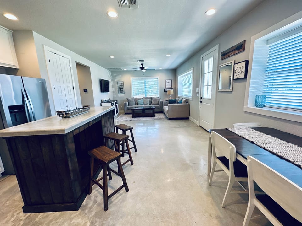 Dining area and living view from door to garage