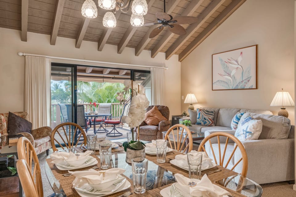 Gather with loved ones around this spacious dining table, set against a backdrop of vaulted ceilings and natural light