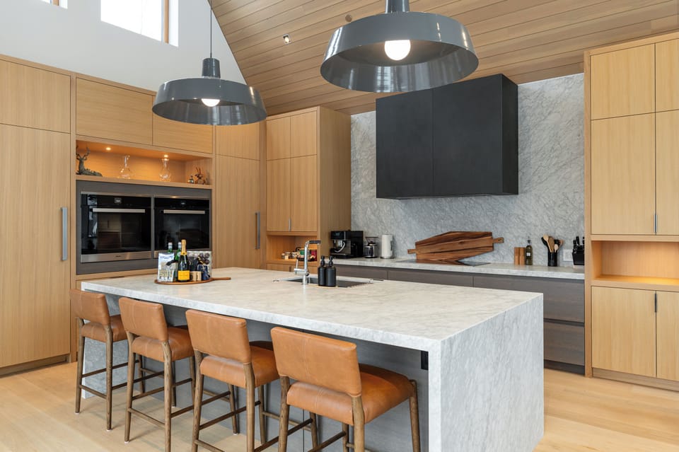 The gourmet kitchen features bar seating for five, state of the art Wolf and Miele appliances, a wine fridge and a separate prep kitchen perfect ideal for private chefs.