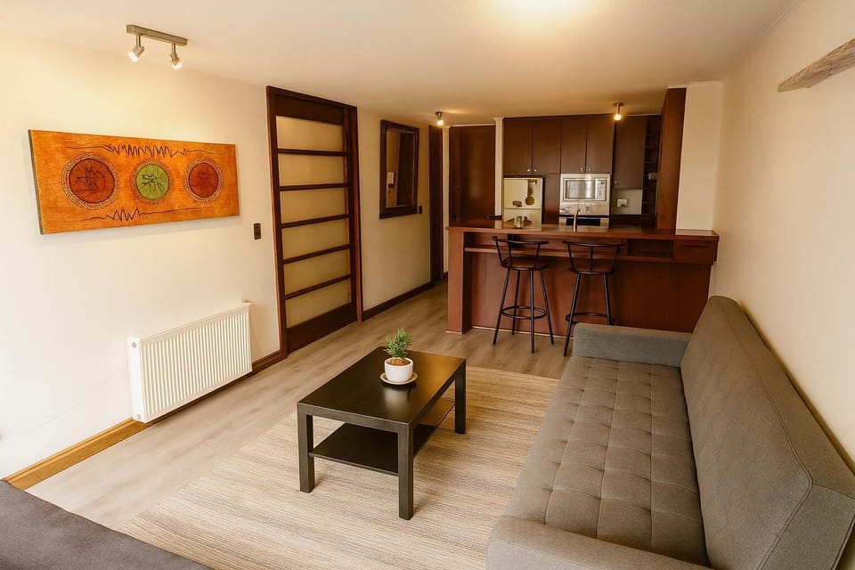 Deluxe Apartment | Living area | Flat-screen TV