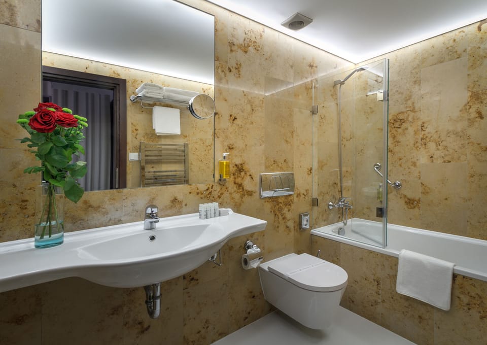 Deep soaking tub, designer toiletries, hair dryer, towels